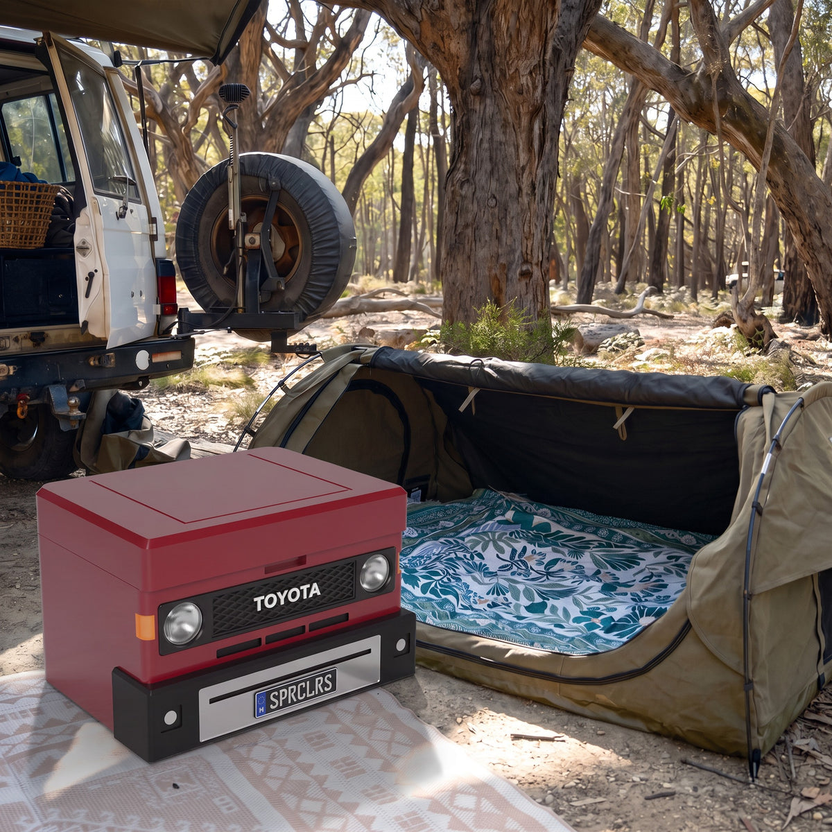 70 Series Red ute mini cooler next to a swag at a bush campsite