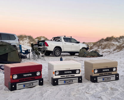 Ute & 4x4 Mini Cooler in 70 Series Red, French Vanilla and Sandy Taupe on the sand at a beach dune camp